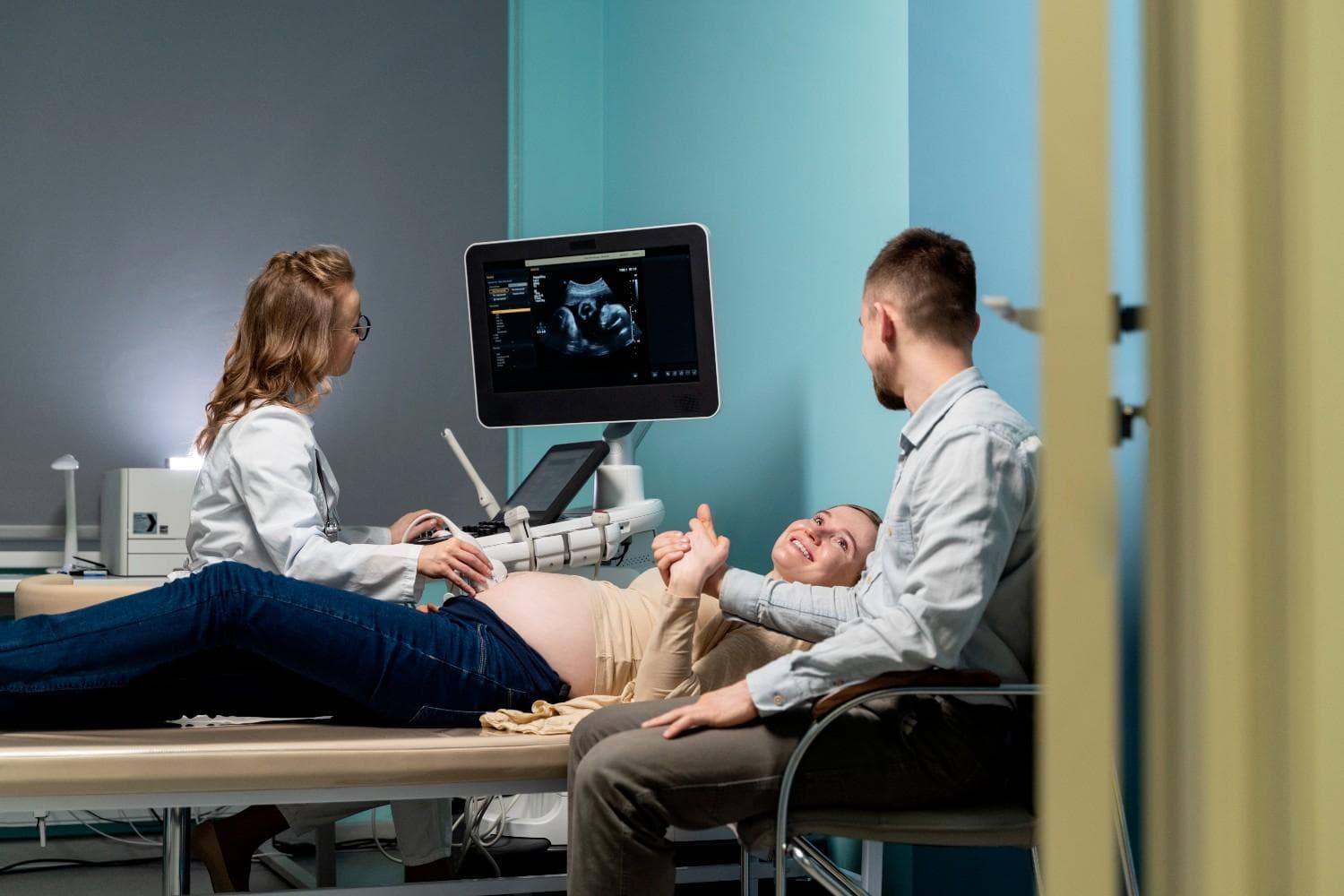 Expecting couple holding gender reveal results at Sunshine Clinical Lab Trinity FL
